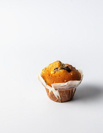 A sweet and delicious cupcake filled with raspberry jam, on white backgroundの写真素材