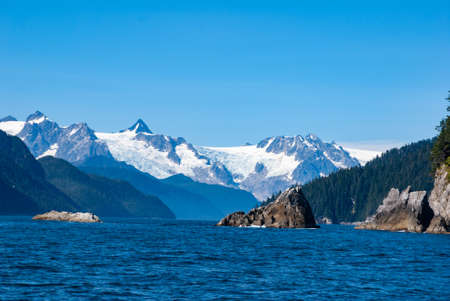 Glaciers in the mountain on the edge of the ocean in Alaskaの写真素材