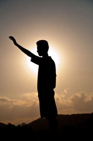 Silhouette of  free boy happy