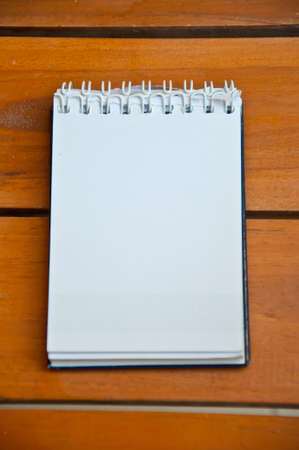 blank paper on wood backgroundの写真素材