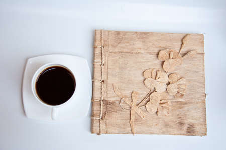 black coffee and paper on white background