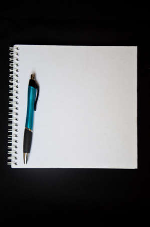 white notebook on black background