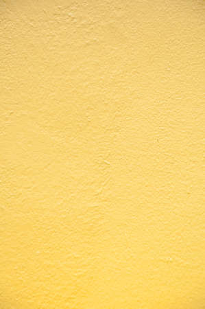 yellow wall texture backgroundの写真素材