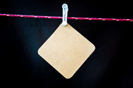 hang paper on black backgroundの写真素材