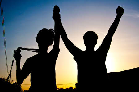 silhouette of man with medal prizeの写真素材
