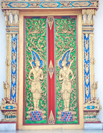 Thai ancient art door in the templeの写真素材