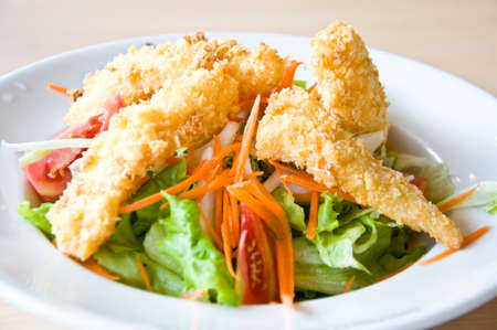 fried fish with salad for healthy eatingの写真素材