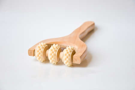 wood tool for massage on white backgroundの写真素材