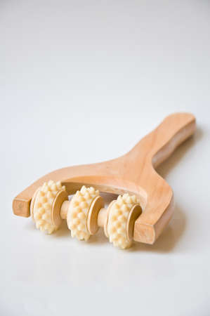 wood tool for massage on white backgroundの写真素材