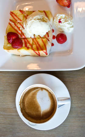 strawberry toast with latte coffeeの写真素材