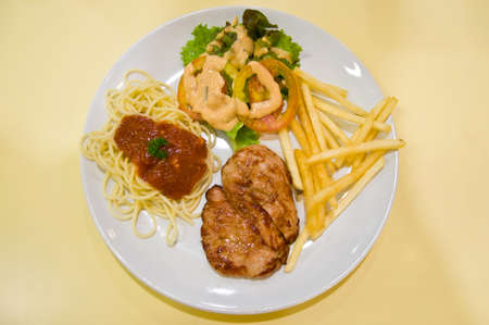 pork steak with frenchfried for mealの写真素材