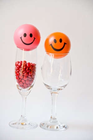 red pill in glass on white の写真素材