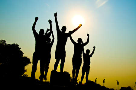 silhouette of man jumping for happy together