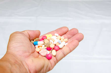 colorful of medicine in handの写真素材