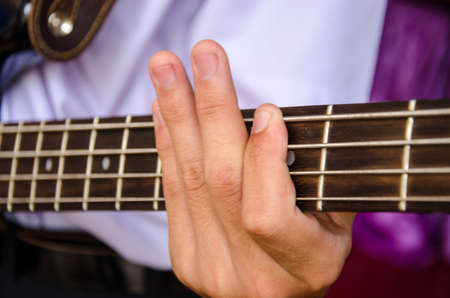 hand for Bass guitar and musicの写真素材