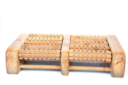 foot massage machine from wood on white backgroundの写真素材