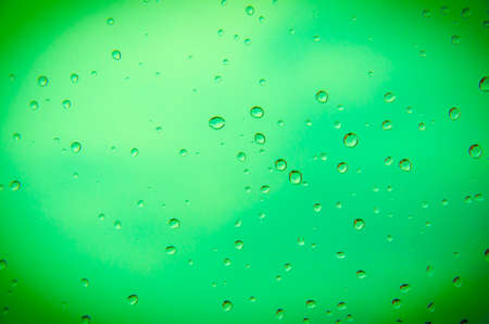 drop water with green backgroundの写真素材