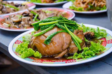 delicious Thai food call KHAMOO from boiled pork with herbal ingredient and vegetableの写真素材