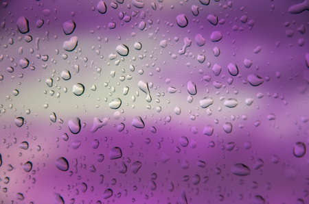 abstract violet background with drop waterの写真素材