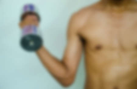 man with dumbell for fitness and healthy with blur option