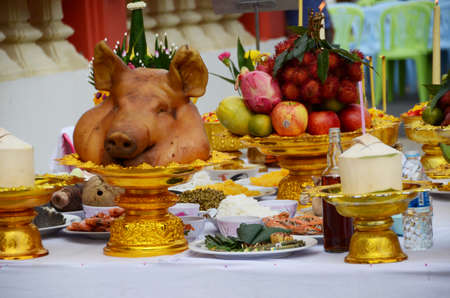 sacrifice with head pig and tradition fruit for Godの写真素材