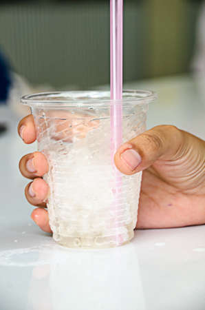 hand for glass of ice for refresh and cold drink
