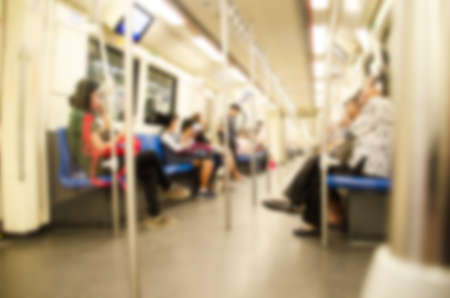 blur of people travel by subway train