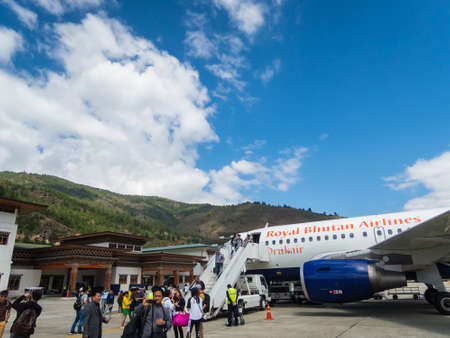 MAY 5: Unidentified people after landing on Paro airport with airplane Airbus from Drukair airlineのeditorial素材