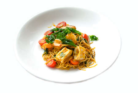 Stir fried spicy spaghetti with seafood call KEE MAO TA LAY on white backgroundの写真素材