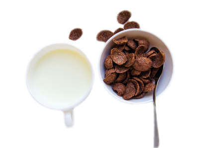 brown cereal with milk for breakfast meal on white backgroundの写真素材