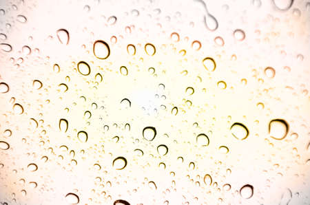 Abstract drop water with orange backgroundの写真素材