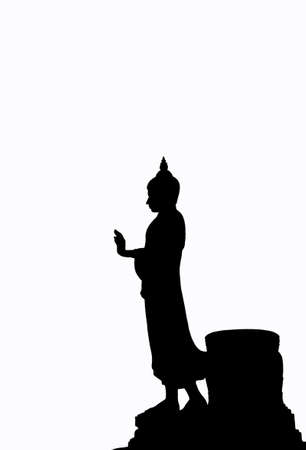 silhouette of standing Buddha statue on white backgroundの写真素材