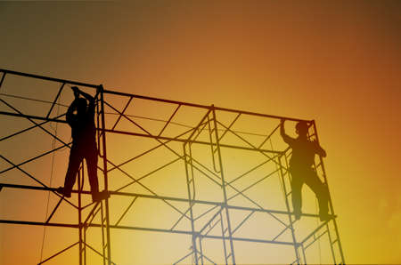 silhouette of man working for construction