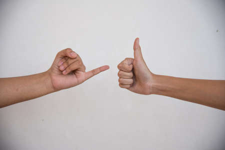 thumb for positive and one  finger concept on white backgroundの写真素材