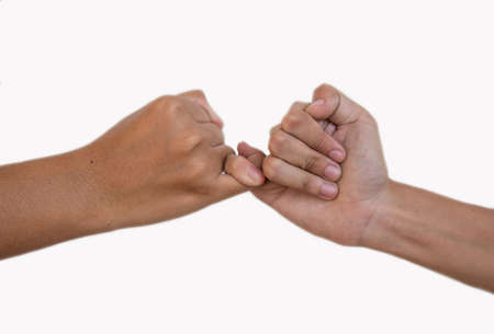hands making promise  a friendship concept on white backgroundの写真素材