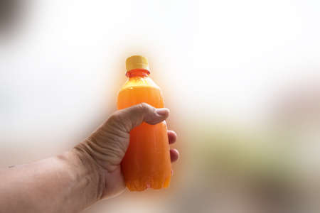 hand for orange juice for healthy の写真素材