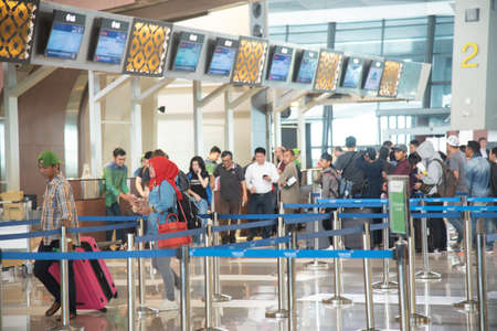 unidentified people checking in Soekarno-Hatta International Airport is the main airport on the island of Java. JAKARTA, INDONESIA June 16 2019のeditorial素材