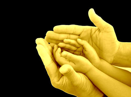 protection hand for support children hand on white backgroungolden dの写真素材