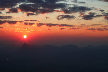 sundown with mountain and silouette hillの写真素材