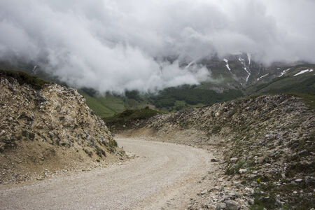Mountain road go to the fog