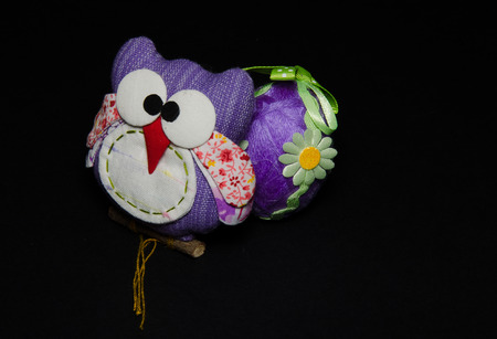 Violet owl and easter eggの写真素材