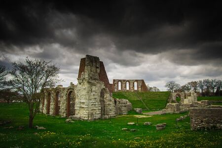 Dark storm on the ruins of the roman theatre in Gubbioの写真素材