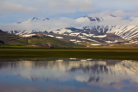 Castelluccio di Norcia in Umbria at sunsetの写真素材