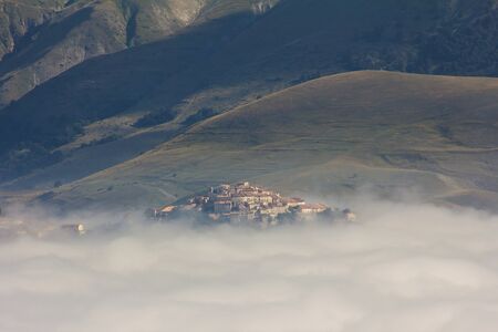 Little village lost in the fogの写真素材