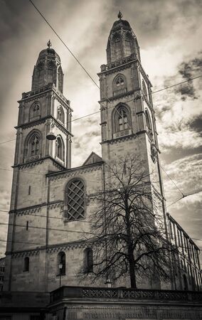 Dark view of Grossmunster gothic church in the historic center of Zurichの写真素材
