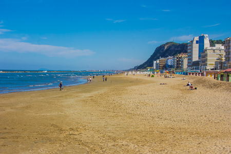 Tourist walking on Pesaro beach in the summer season, Marche, Italyのeditorial素材