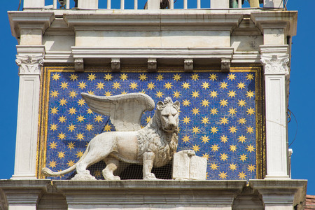 The winged lion of St. Mark is the symbol of the city of Venice in Italy and is often seen holding a book representing power, wisdom and justiceのeditorial素材