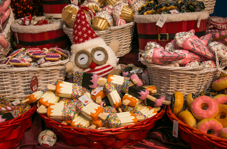 Owl with santa hat in the basket with cake at the interior of Christmas shop in Sant'Elpidio a Mare at wintertimeのeditorial素材