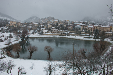 Winter view of Villalago. Village during snow stormの写真素材