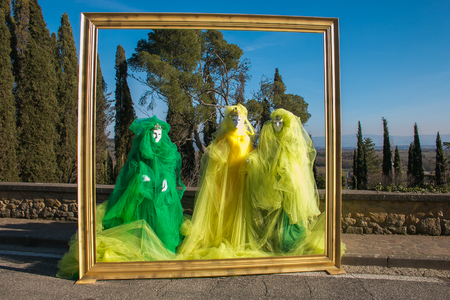 Three carnival masks inside the frameの写真素材